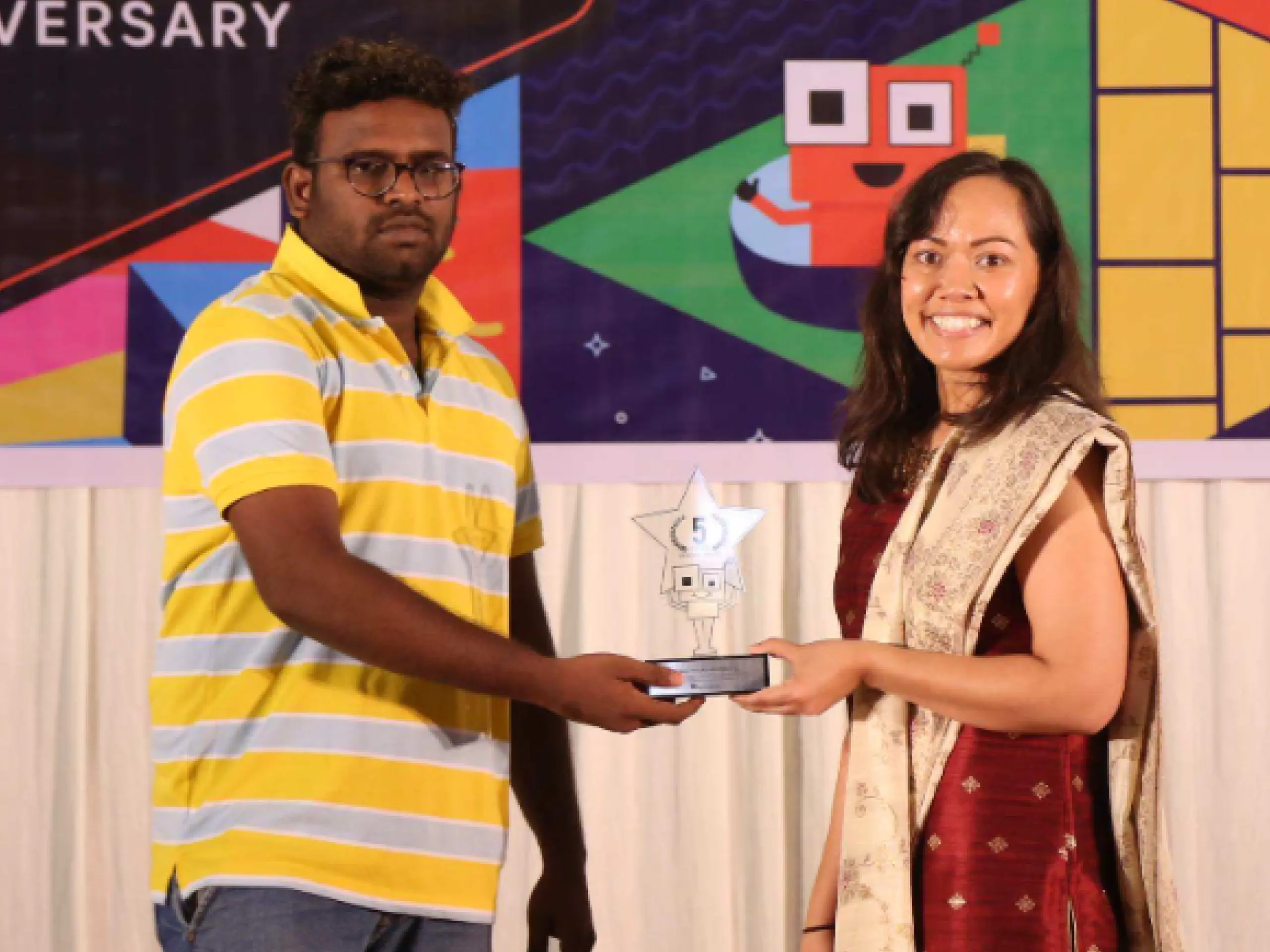 Gangadhar anandavel receiving an award in next event