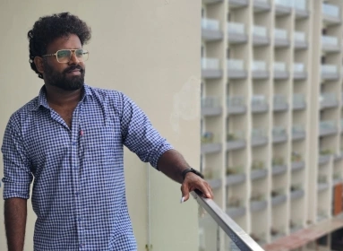 Gangatharan Anandavel in a corridor