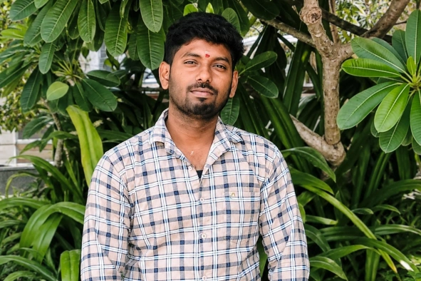 Balaji Sekar standing behind the tree