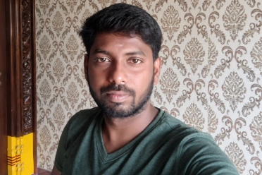 Balaji Sekar taking selfie near wall