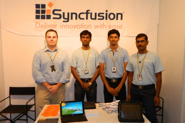 Balaji with team near syncfusion banner