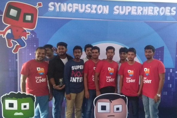 Gobalakrishnan with team members in cody backgorund banner