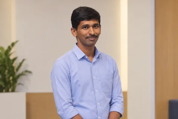Gunasekaran Thirumoorthy standing in office space