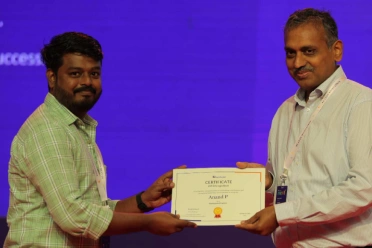 Anand Panchamoorthi Receiving an Award from Davis