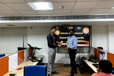 Anand Panchamoorthi Receiving an Award from Baskaran