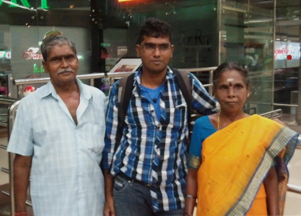 Balaji with his mother and father