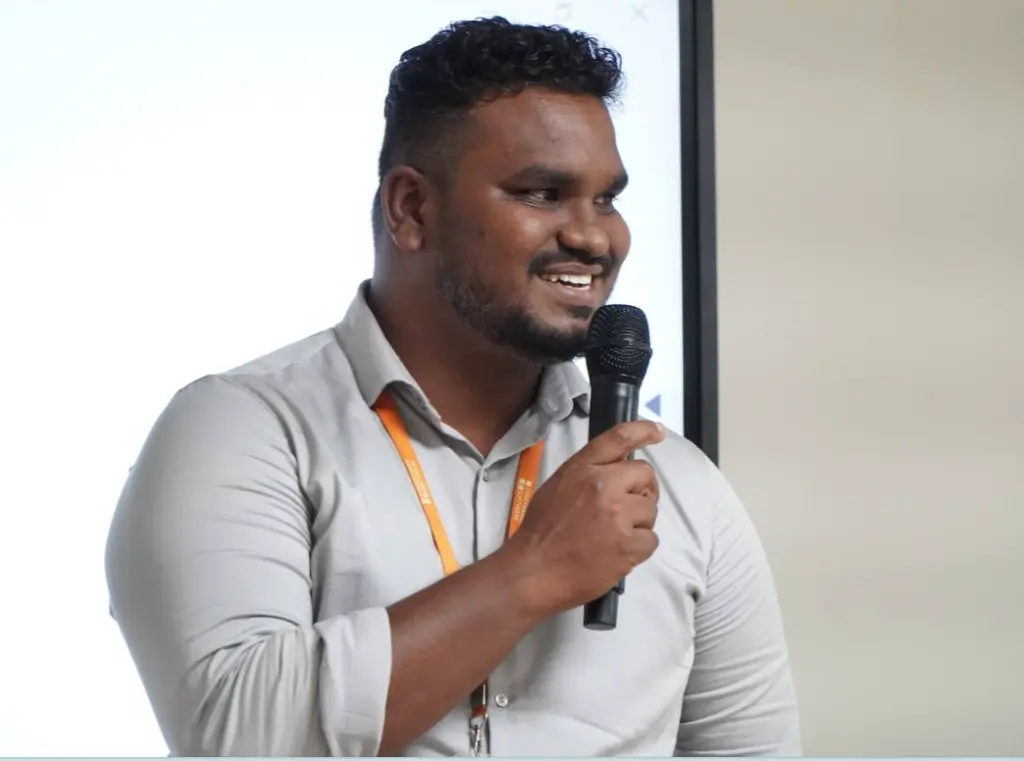 Bhuvanesh valarman holding mike in team meet up
