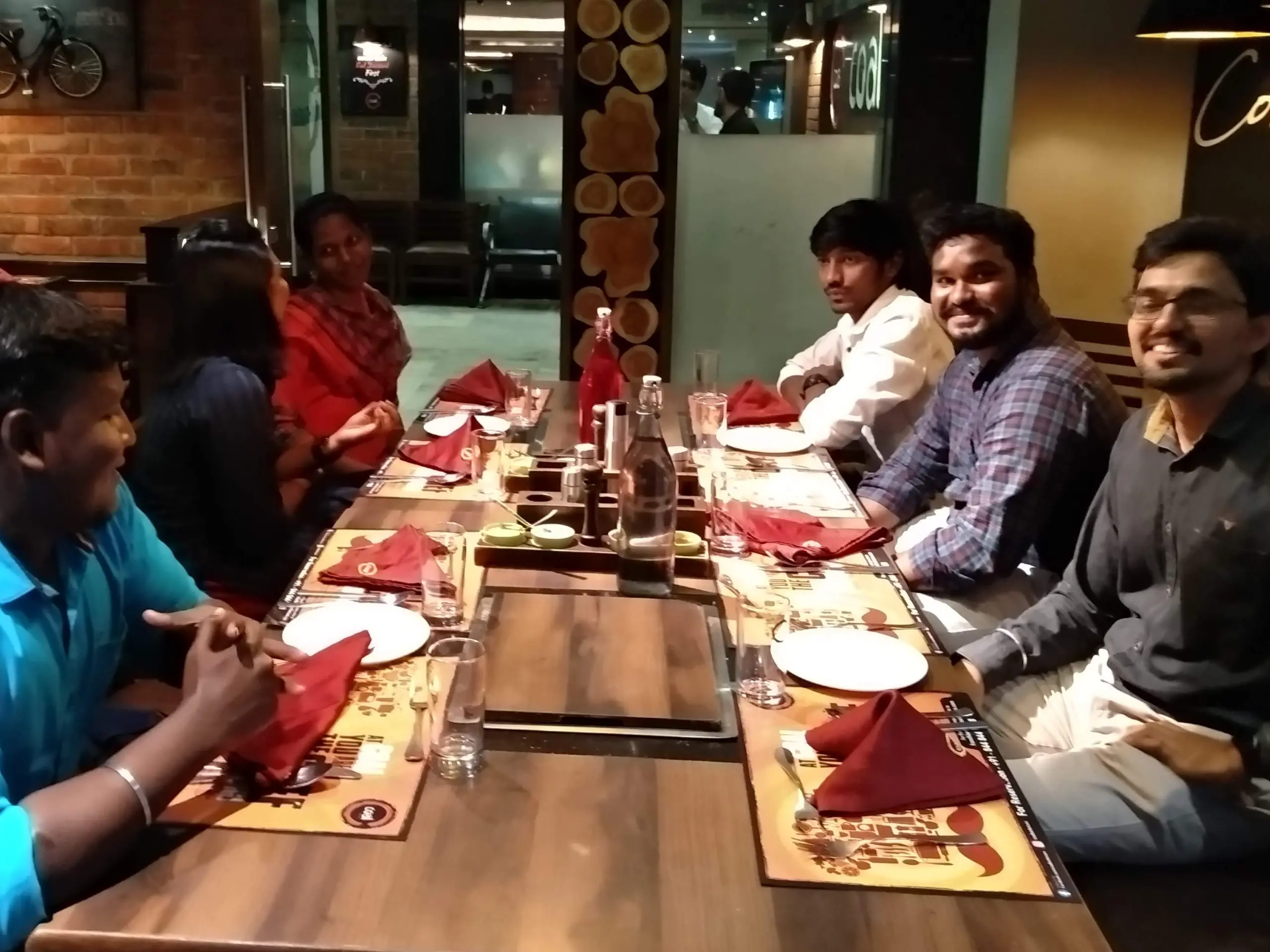 Bhuvanesh valarman with office mates in restaurant