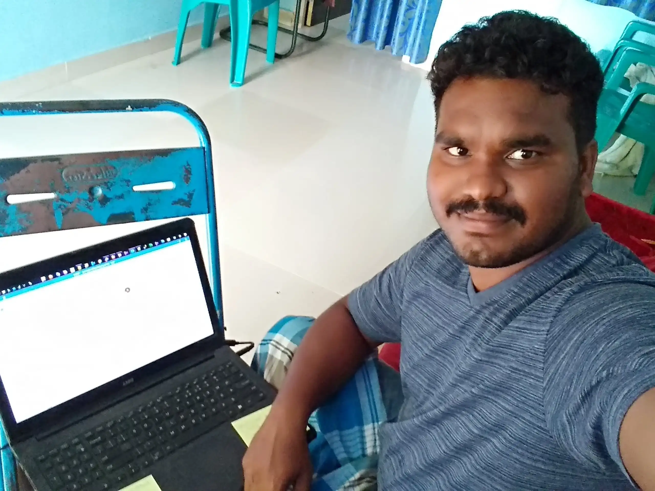 Bhuvanesh valarmann taking selfie with his laptop