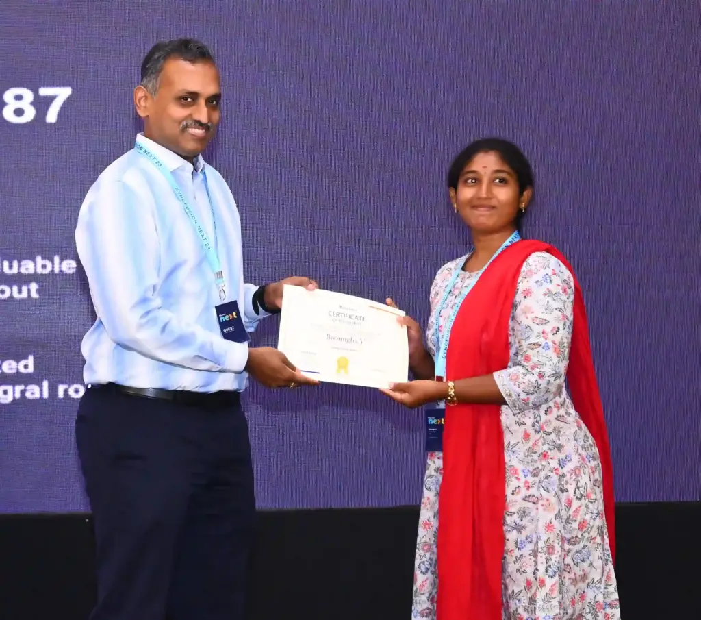 Boomigha Velayutham Receiving an Award