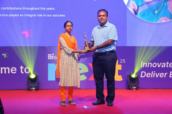 Buvana Sathasivam receiving award at Next event