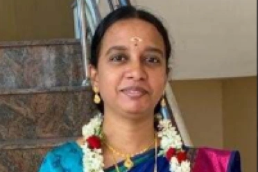 Buvana Sathasivam standing near staircase