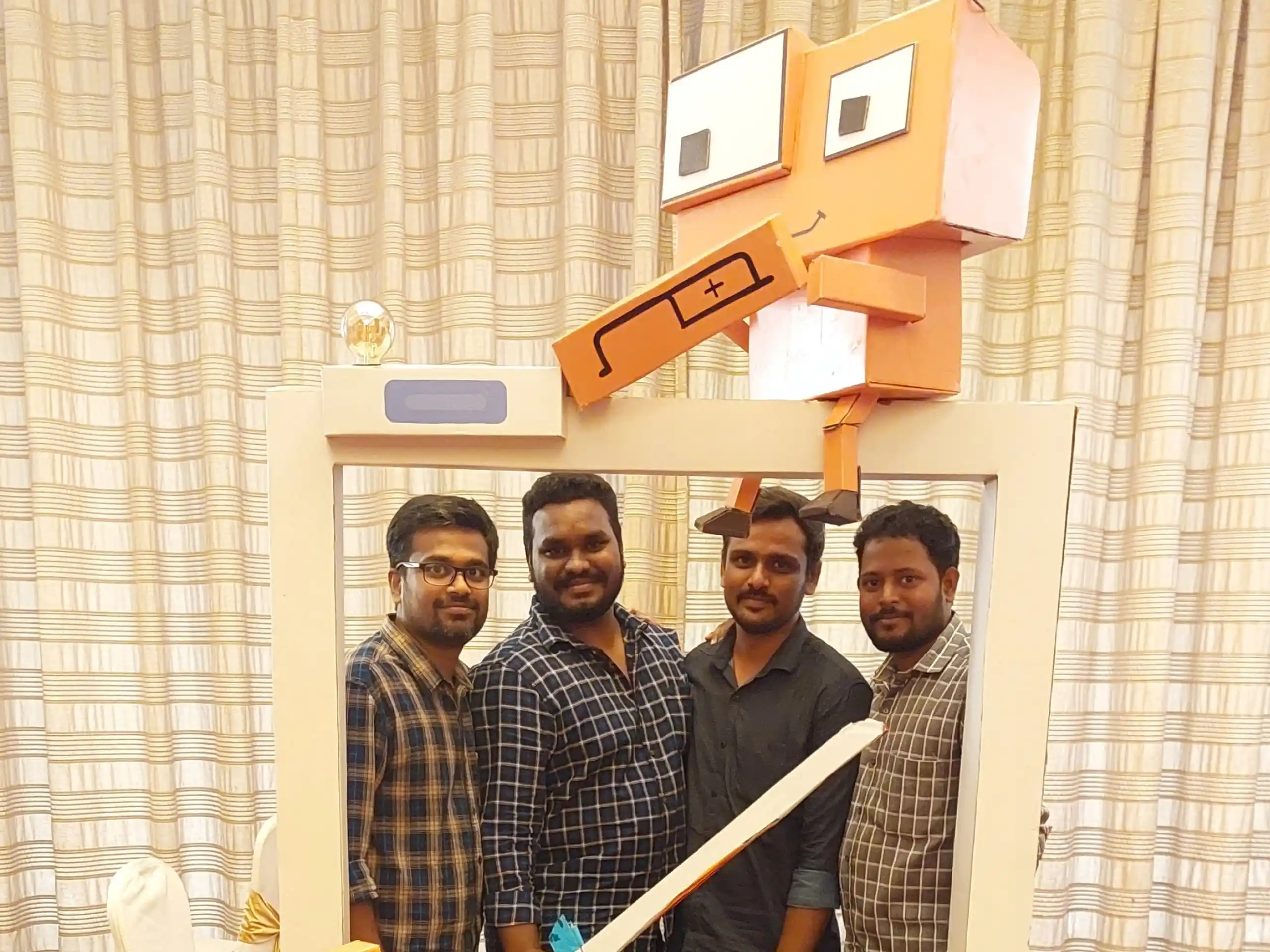 Buvanesh valarman with office mates posing in the cody frame