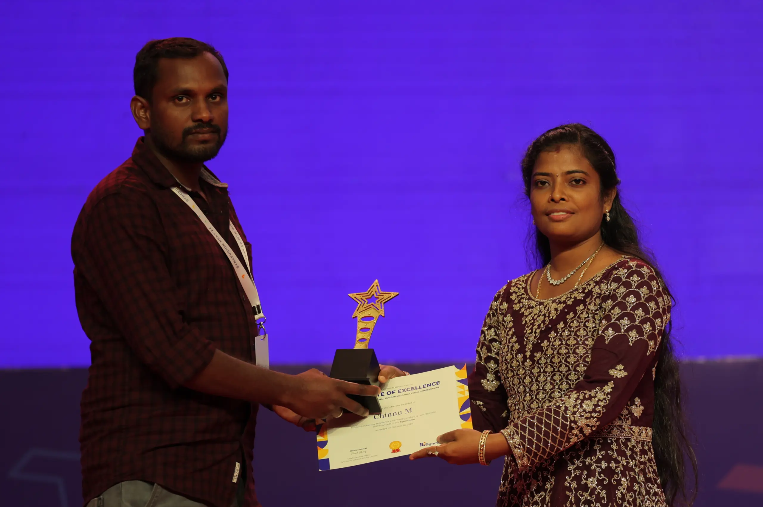 Chinnu Muniyappan Receiving an Award