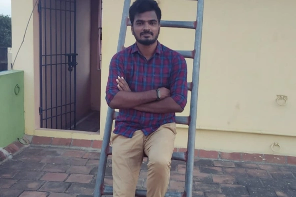 Deepak Gunasekaran standing outside home