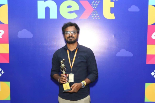 Deepak Gunasekaran with his received award at Next event