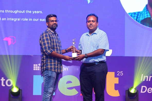 Dharanidharan Dharmasivam receiving award at Next event