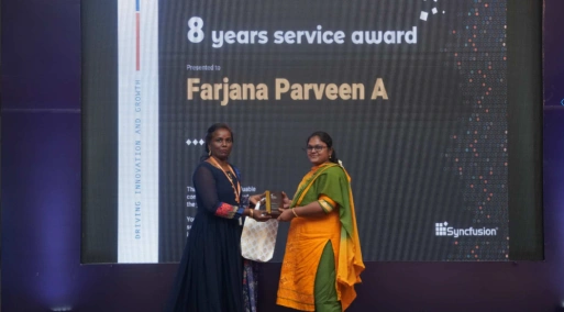 Farjana receving eight-year service award