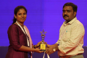 Ganeshwari ganesan receiving an award