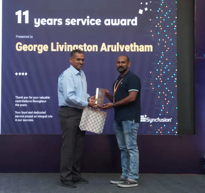 George Livingston Arulvetham Receiving an Eleventh Year Service Award