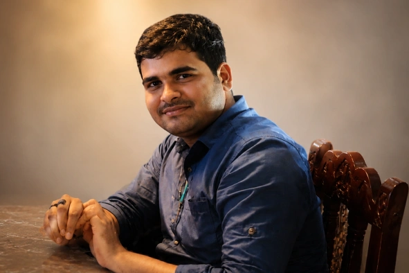 Gobalakrishnan sitting in a chair