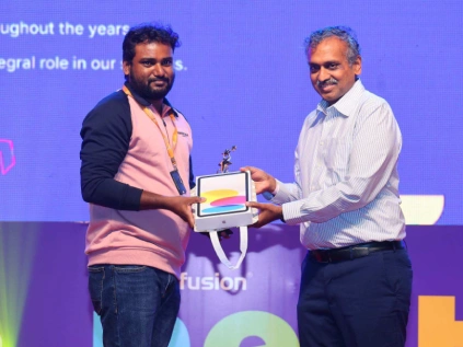 Jayaprakash kamaraj receving award from davis