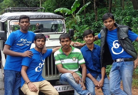 Jegan Raj with friends sitting in jeep