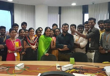 Jegan Raj with team in conference room