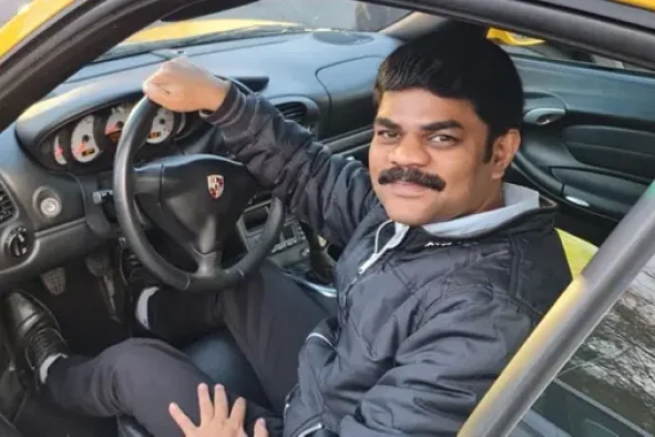 Johnson Monohar sitting in car