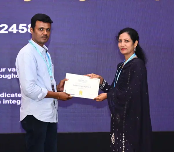 Johnsy Jeya Sophia Joseph Raj Receiving a Certificate