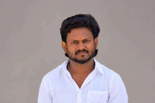 Kalirajan Ganesan standing front for camera