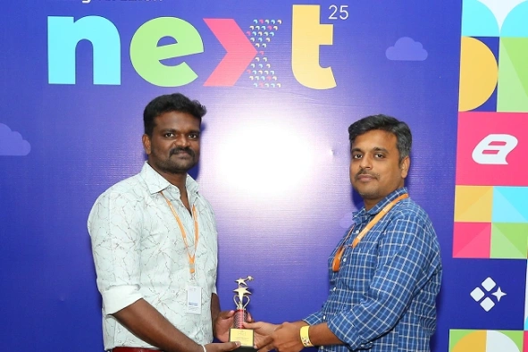 Kameshwaran Rajendran receiving award at Next event