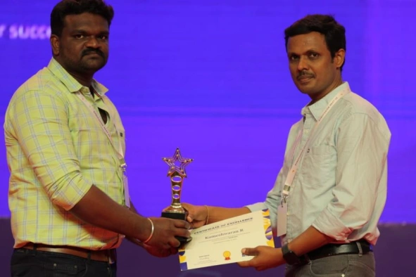 Kameshwaran Rajendran receiving certificate
