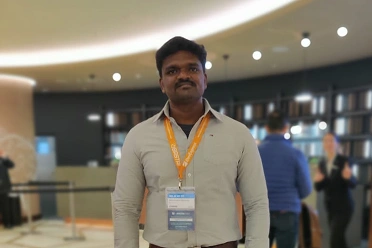 Kameshwaran Rajendran standing at event