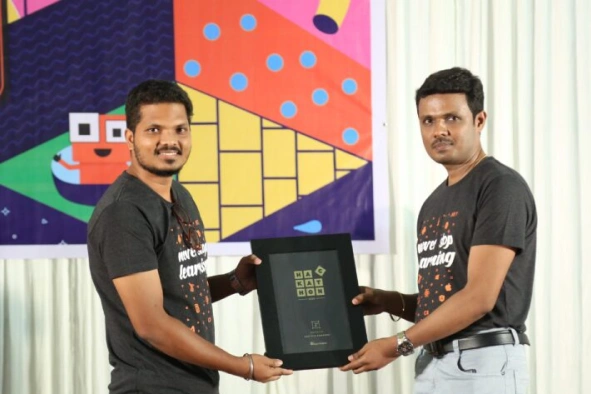 Karthik Anandan receiving hackathon recognition