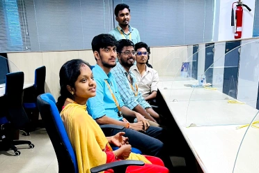 Karthik Raja Arumugam with colleagues during discussion