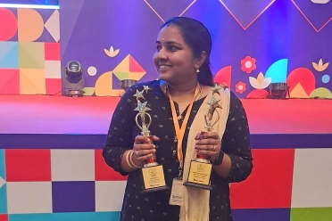 Keerthana holding two awards