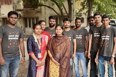 Keerthana Rajendran with her team members in an old event
