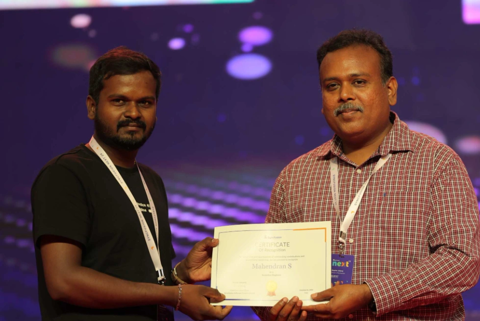 Mahendran Shanmugam Receiving a Certificate