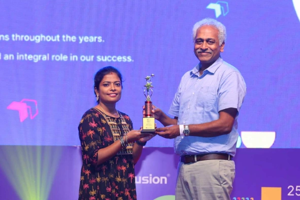 Maithiliy Karthikeyan Receiving an Award from Daniel at NEXT Event