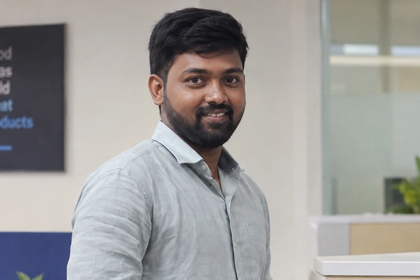 Manikandan Murugesan standing in office space