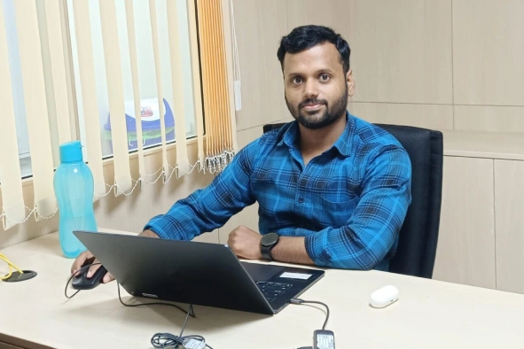 Manoj Babu working in his laptop