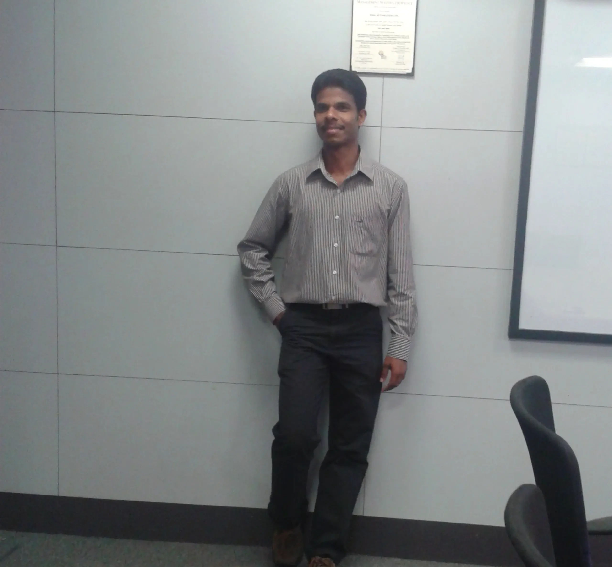 Martin posing for camera in the office space