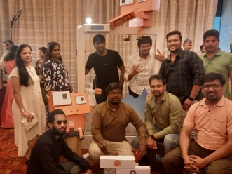 Mohamed Abdul with team in cody frame