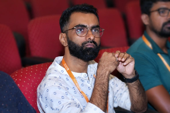 Mohamed Samsudeen sitting in an event