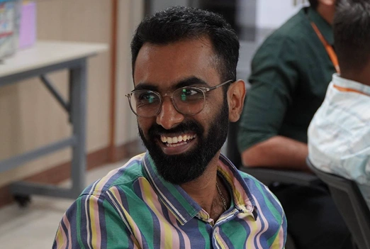 Mohamed Samsudeen smiling at meetup