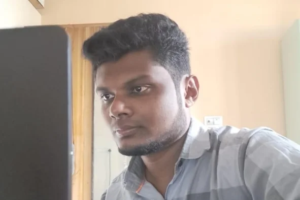 Mohammed Ismail woring in laptop