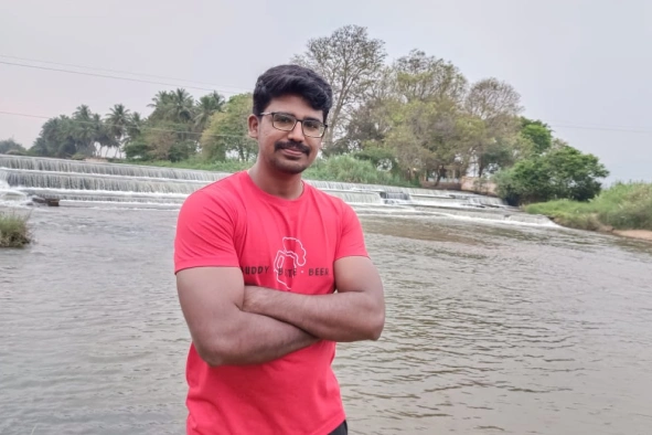 Muneesh kumar standing in the river