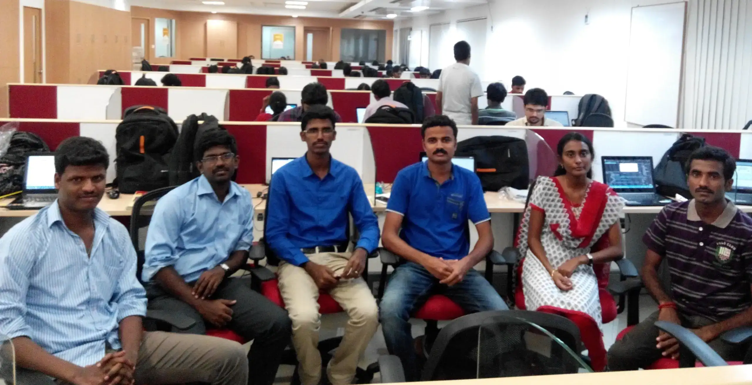 Muneesh kumar working with team in office