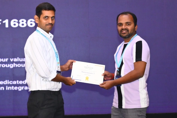 Narayanasamy receving certificate from a manager